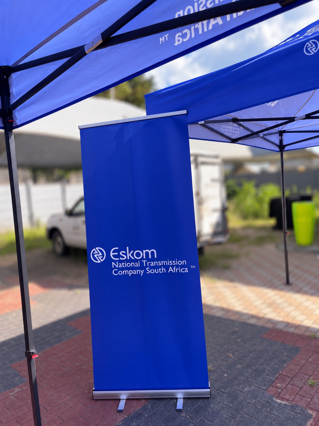 Eskom pull-up banner positioned beneath branded event gazebos